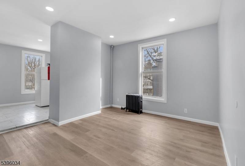 Welcome home to 195 Park Ave in Orange, NJ a beautifully renovated two family residence located in the desirable Seven Oaks Transit Village area.