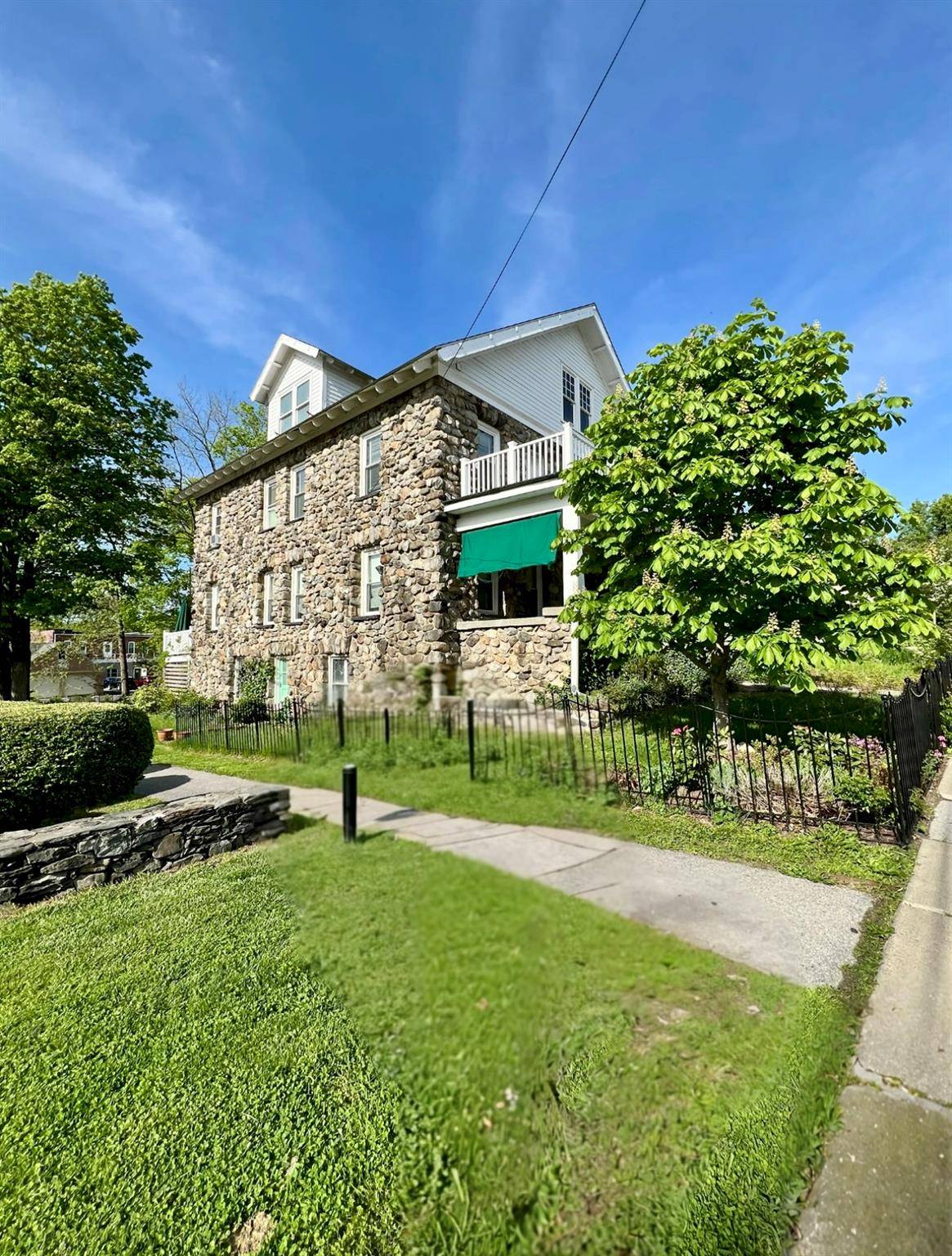 Timeless Elegance for Exceptional Living in this Expansive Home crafted by Italian Stone Masons in 1910, previously known as the Porter House Inn in the Heart of Millbrook Village.