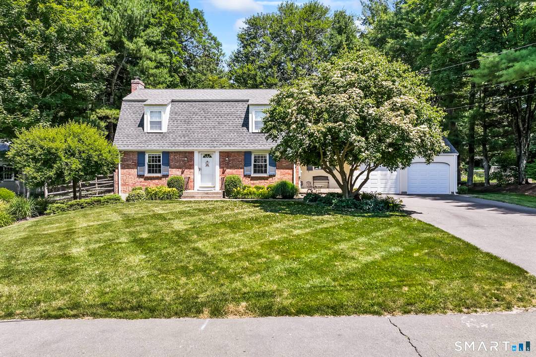 Welcome home to this charming Gambrel Colonial nestled in a highly desirable central Simsbury neighborhood.