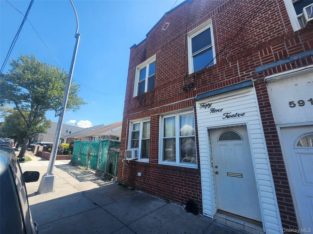 Welcome to 59 12 58th Road in Maspeth, Queens a rare two family brick home that offers incredible investment potential.