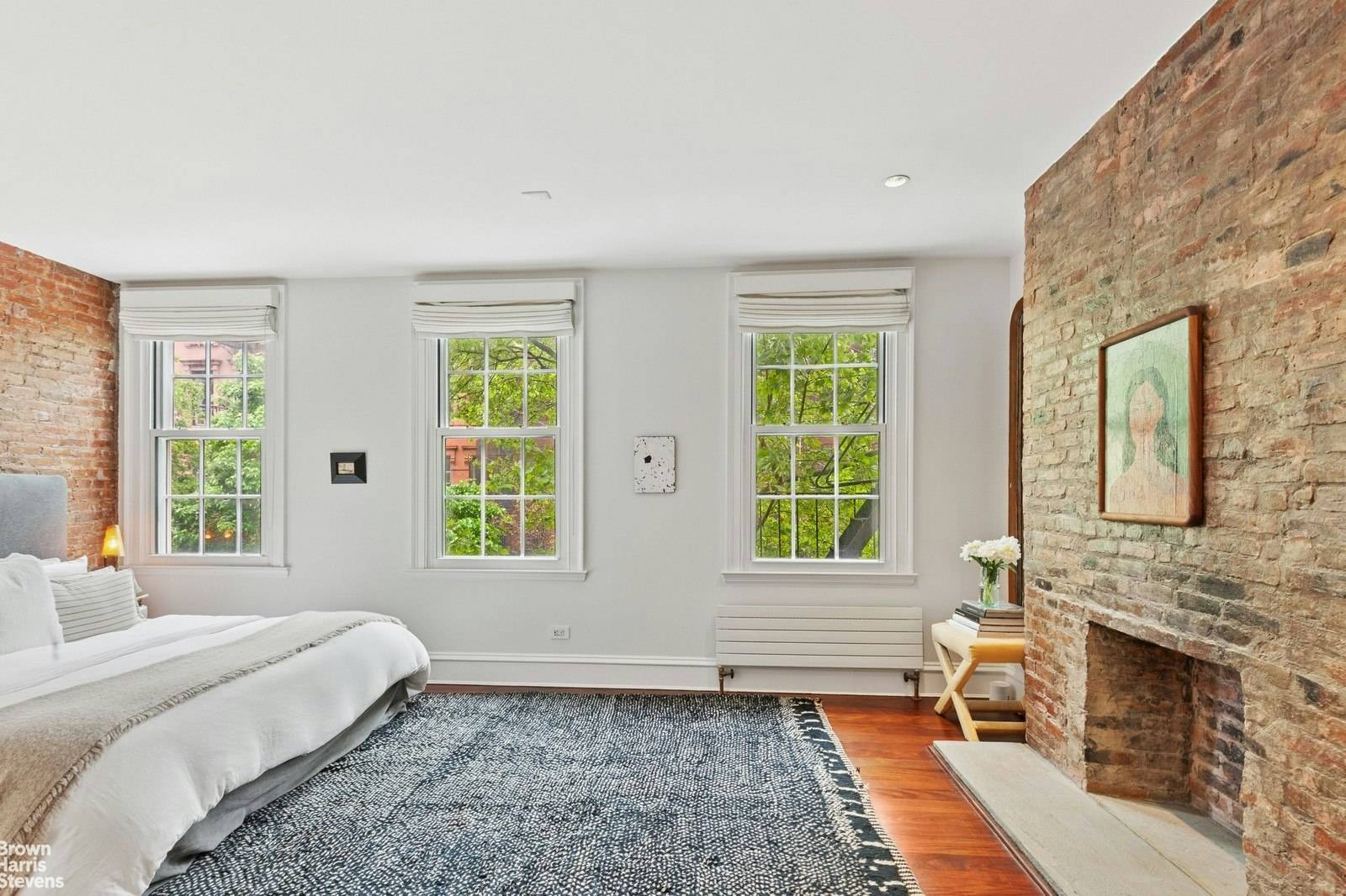 This 1829 four story townhouse is situated on a tree lined, cobble stone street in the landmark district of West Village.