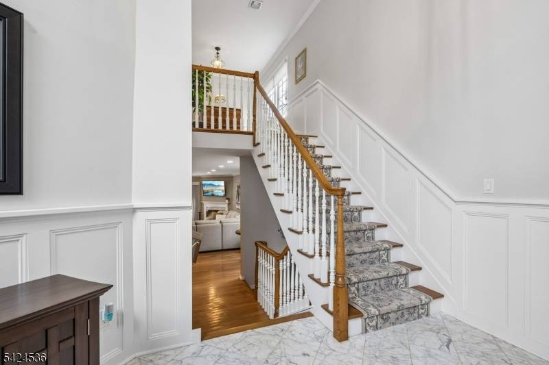 Exquisitely updated, this oversized townhouse is a standout !