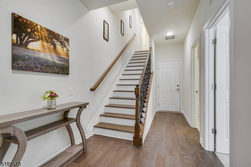 Stunning sundrenched townhome with incredible living spaces, phenomenal OPEN floor plan Sophisticated state of the art Gourmet chef's kitchen, soft close cabinets beautiful new backsplash.