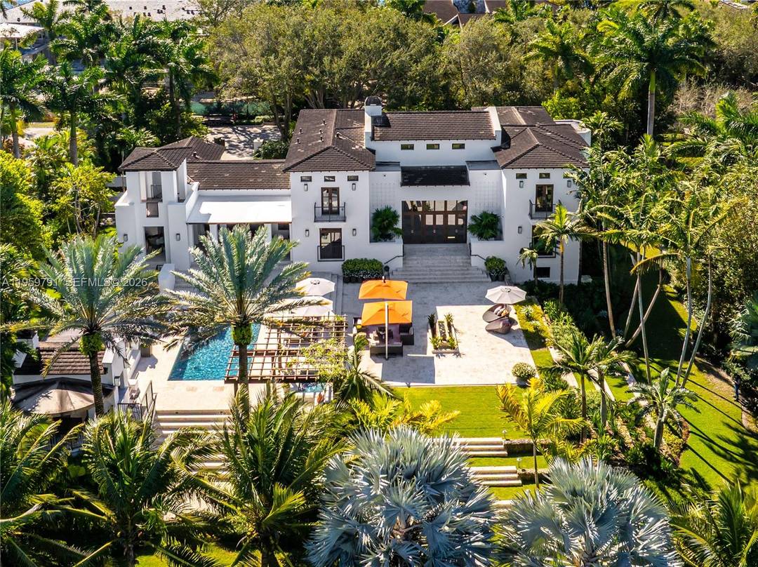 Welcome to 555 Arvida Pkwy a stunning Mediterranean AND Modern estate on over an acre in coveted Gables Estates !