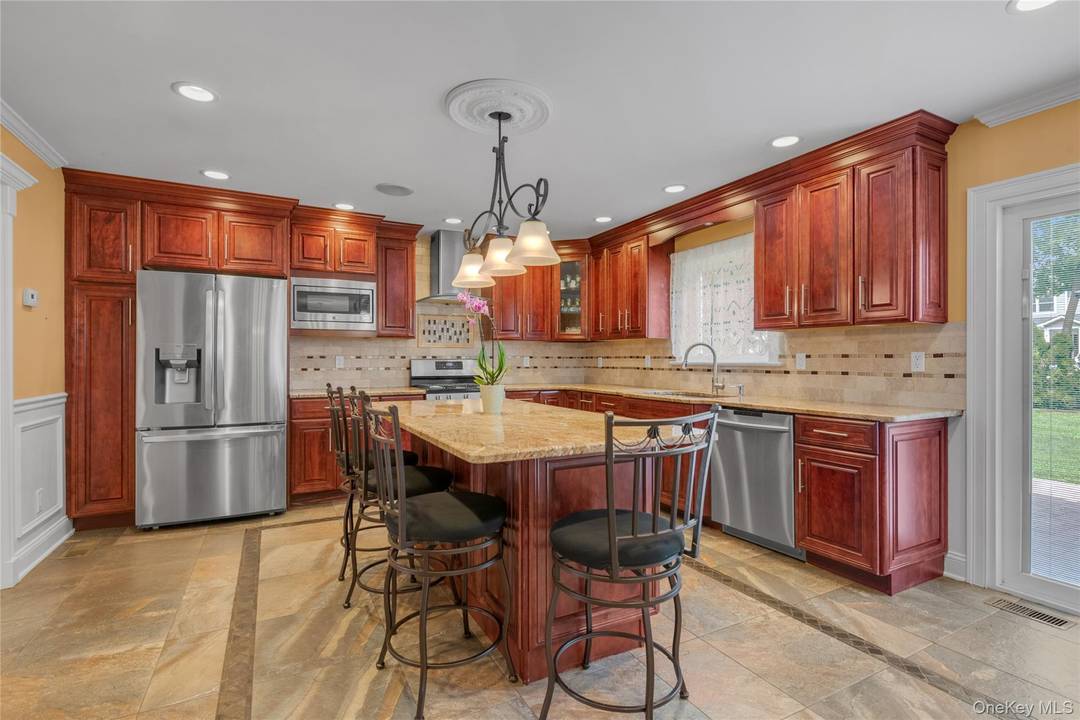 Welcome to 10 Field Avenue in Hicksville, a spacious 5 bedroom, 2.