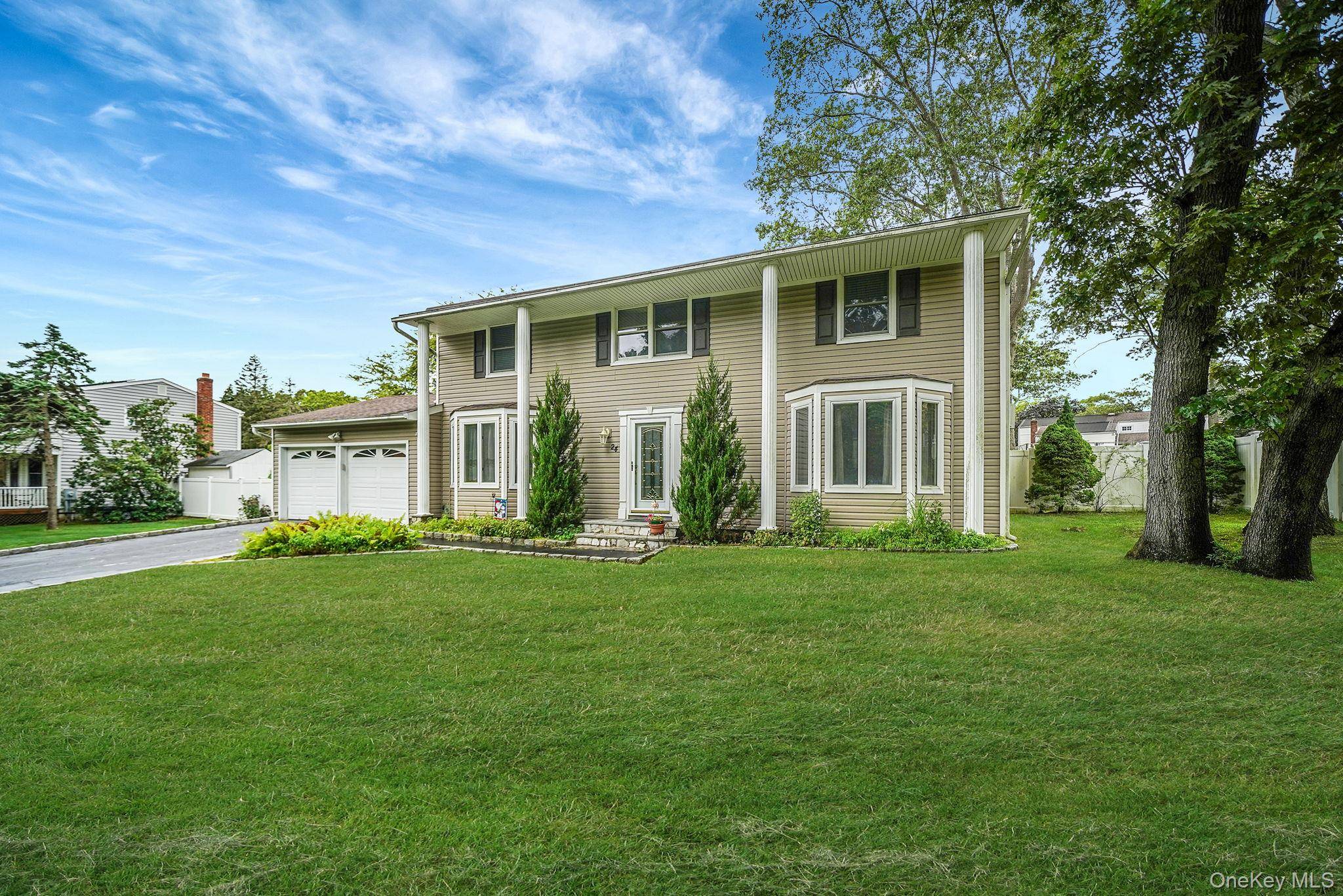 Welcome to this stunning Colonial style home in Farmingville, NY !