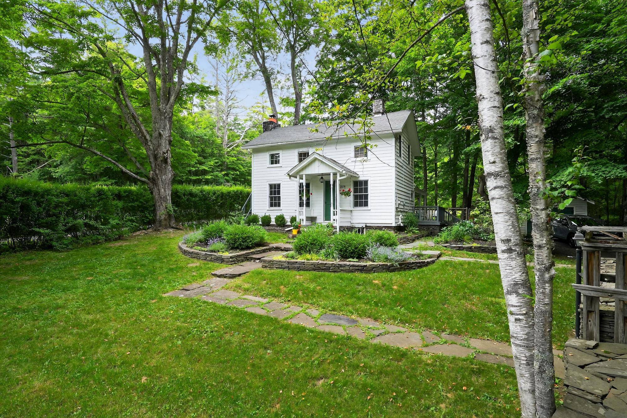 This classic 1890s farmhouse marries period charm with high end modern amenities in a natural setting.