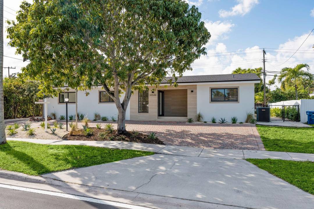 Completely rebuilt from floor to ceiling, this brand new bespoke residence delivers modern luxury in the highly sought after Highland Lakes neighborhood.