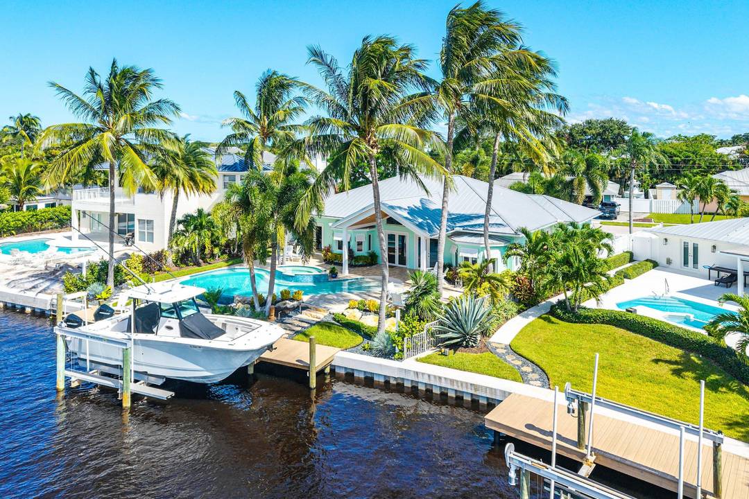 Discover refined coastal living in this beautifully updated 4 bedroom, 3 bath CBS Key West inspired waterfront home, ideally situated in the heart of Jupiter.