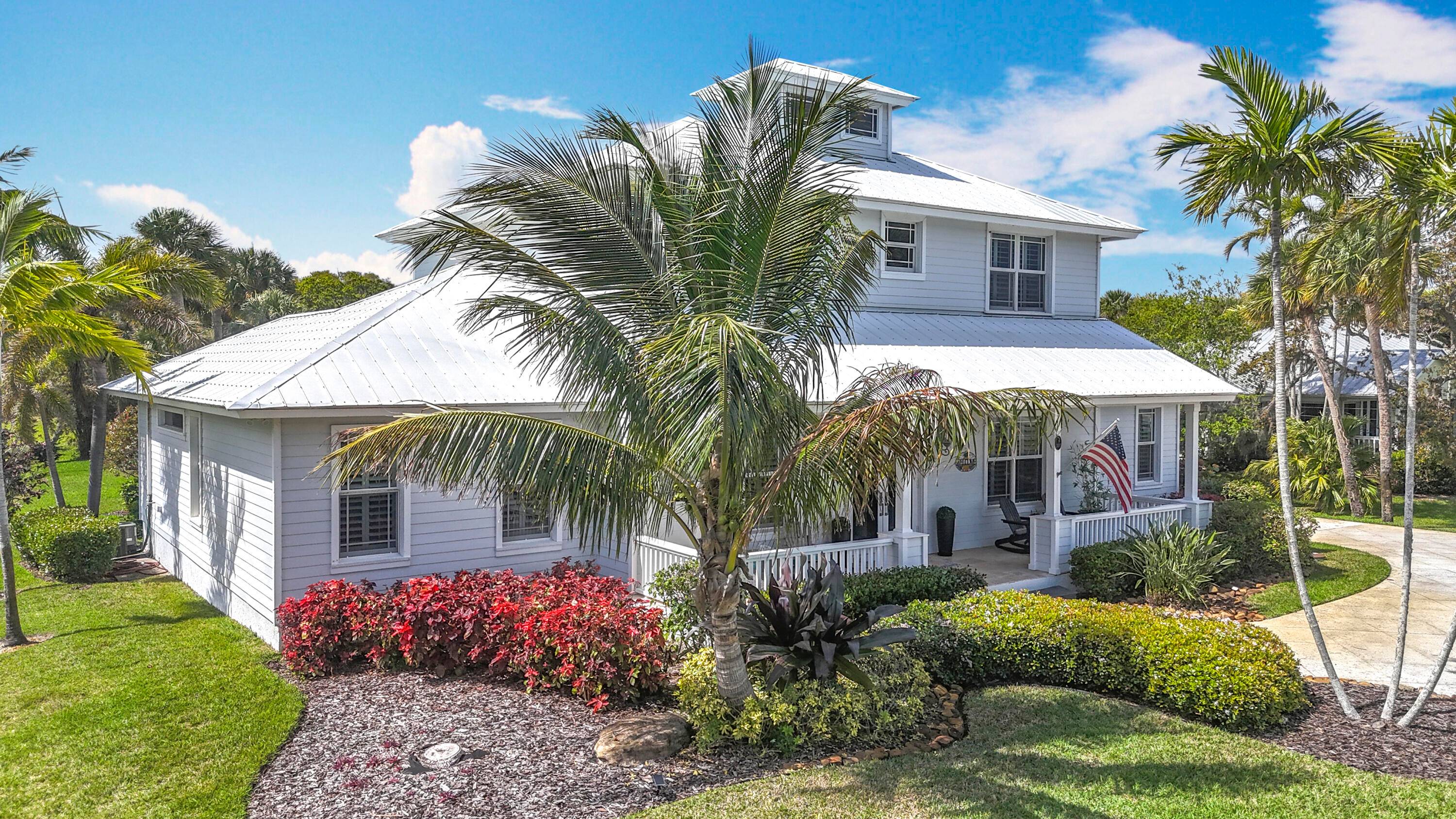 Discover the epitome of coastal elegance with this stunning waterfront estate, nestled on over half an acre of lush, meticulously landscaped grounds.