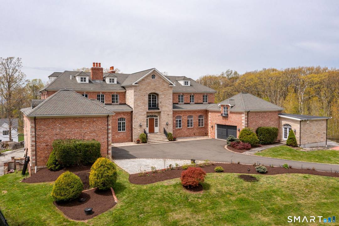 Introducing a remarkable brick estate perched atop Avon Mountain in Avon.