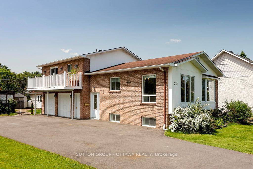 Welcome to 223 Des Outaouais Street in the heart of Rockland, just steps from the Rockland Golf Club !