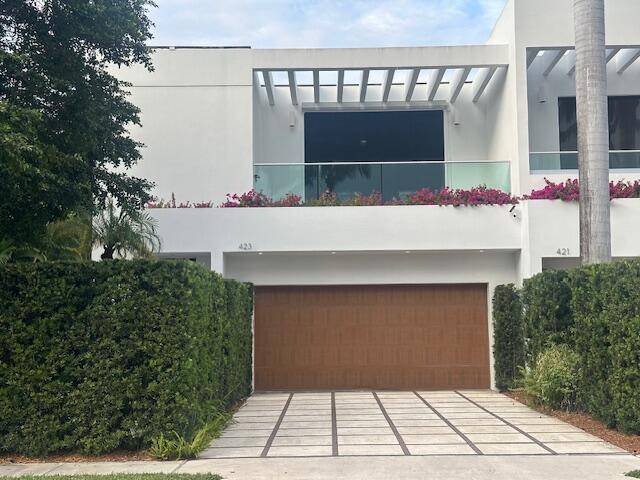 Stunning contemporary townhome situated in coveted midtown location on Palm Beach Island.