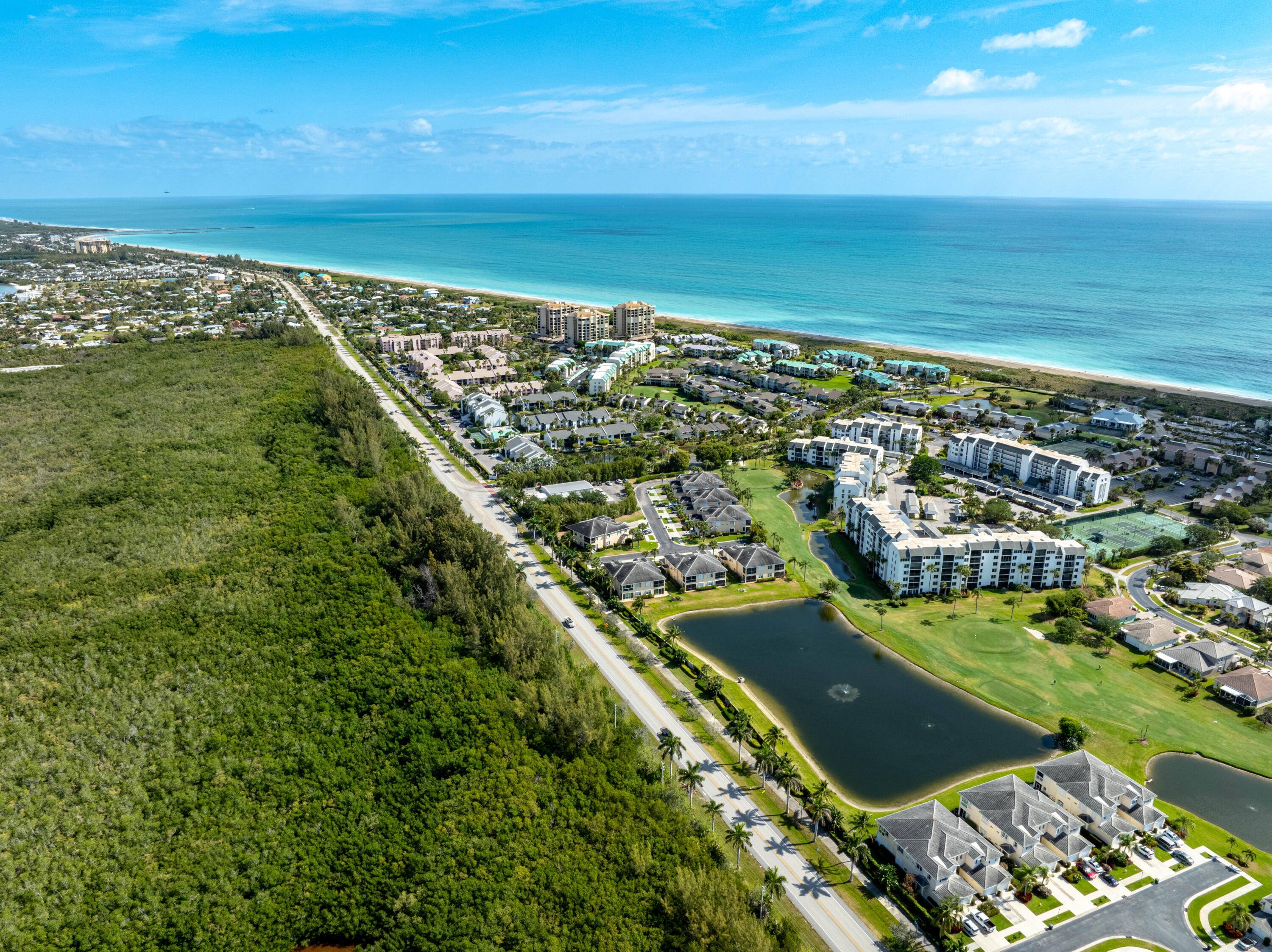 LOCATION LOCATION LOCATION Over a 1 2 Acre of private land directly off A1A awaits your future home !