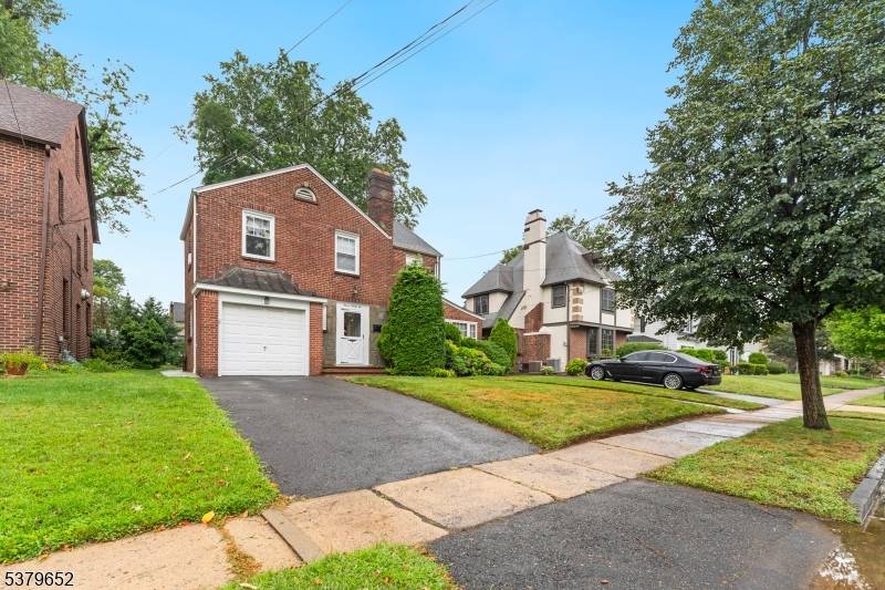 Welcome to this beautifully maintained Colonial home, located on a charming tree lined street, in the desirable Elmora Hills section of Elizabeth.