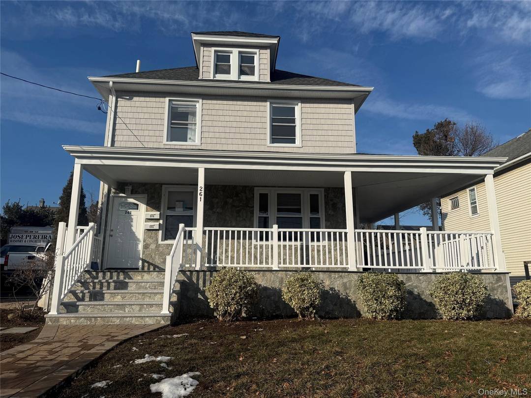 Welcome home to the first floor of this beautifully renovated legal two family residence, located in the heart of Westbury Village.