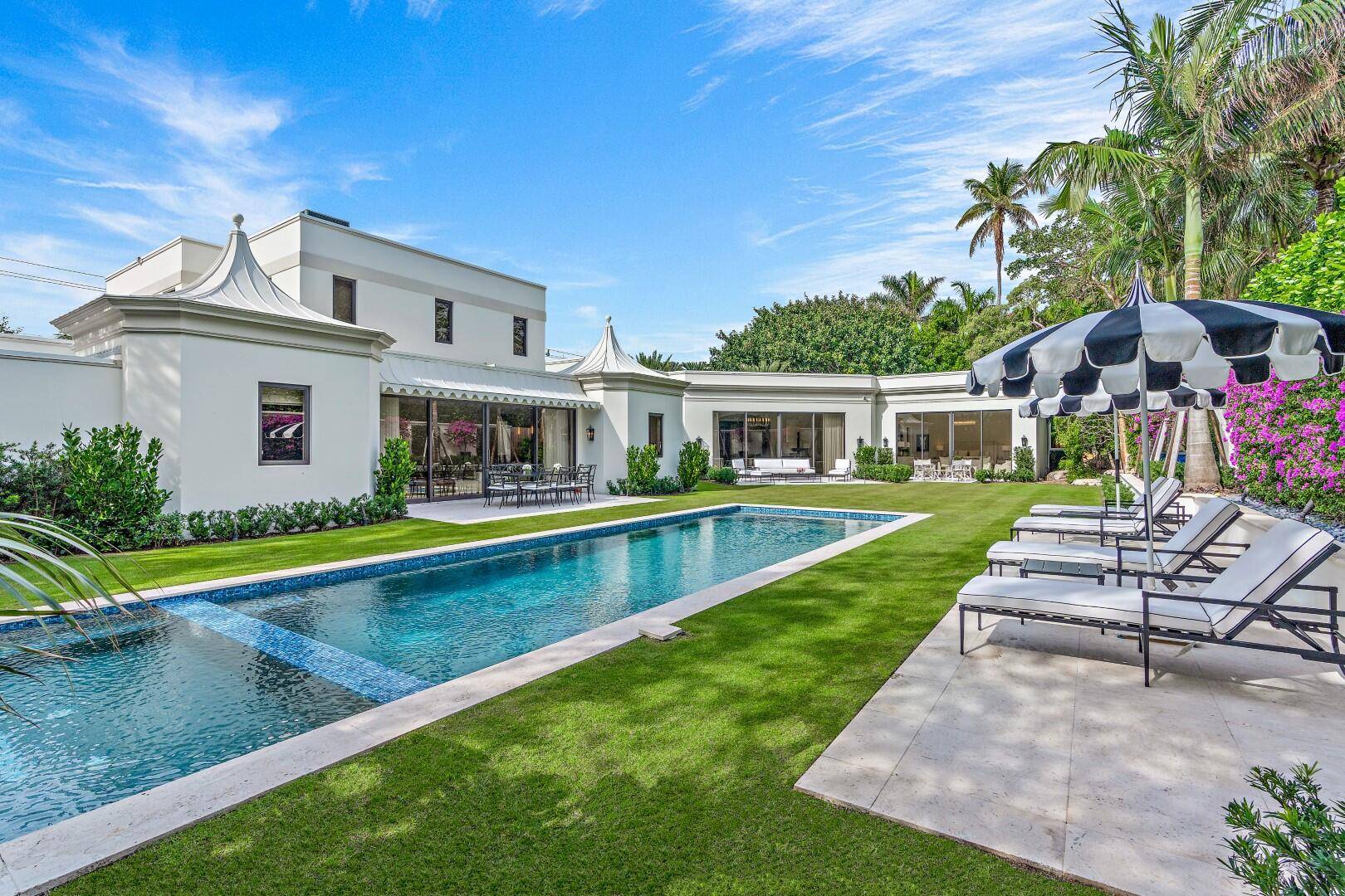 Stunning Palm Beach classic Regency estate with library, 7 bedrooms, 9 baths, and powder room.