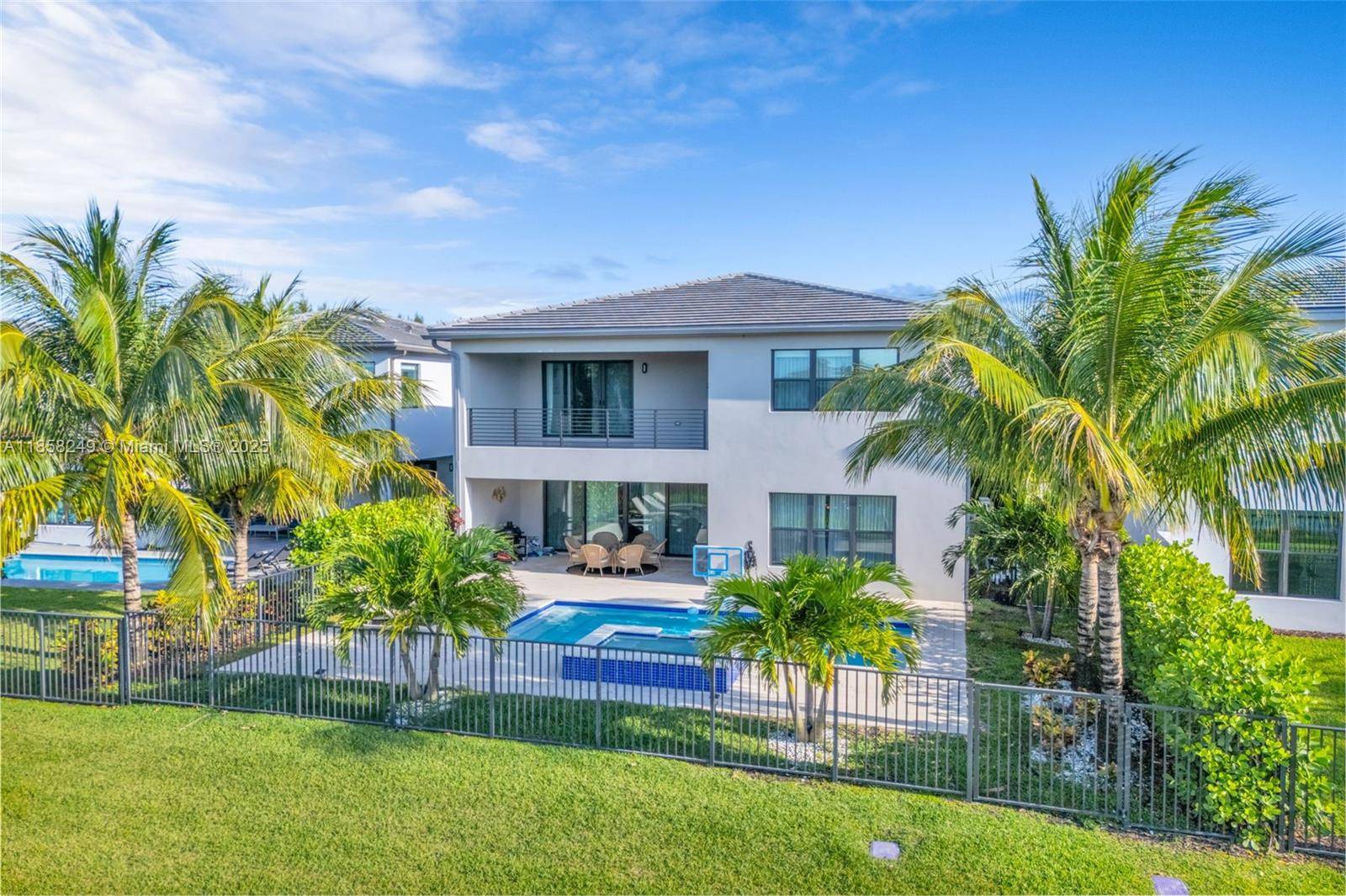 Located in Lotus, one of Boca Raton's most prestigious gated communities, this stunning 5 bedroom, 5 bathroom e perfectly blends modern style with timeless luxury.