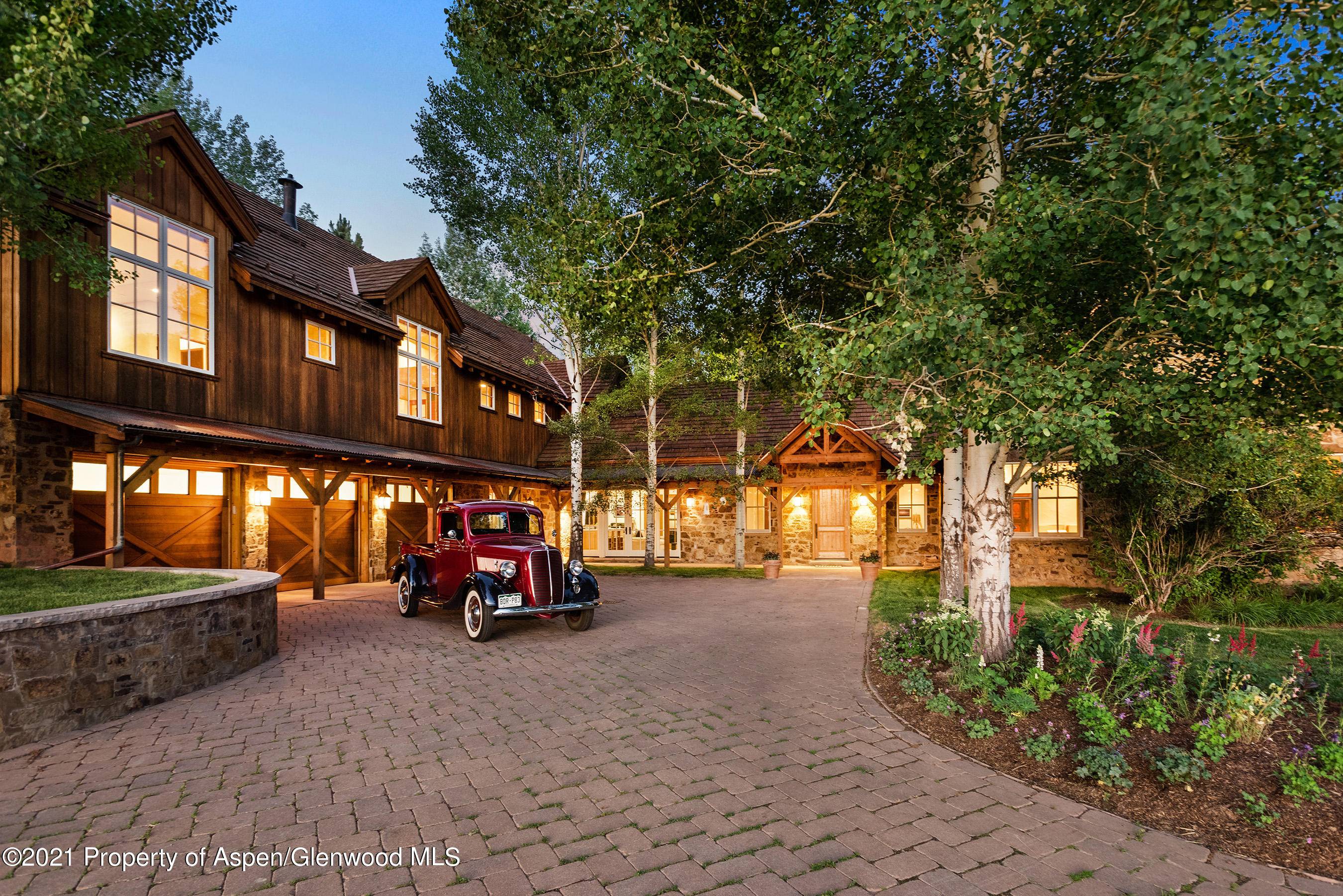 Timeless mountain estate located in an idyllc setting with lush landscaping, mature trees, fenced horse pasture and expansive views that all contribute to this properties sense of tranquility.