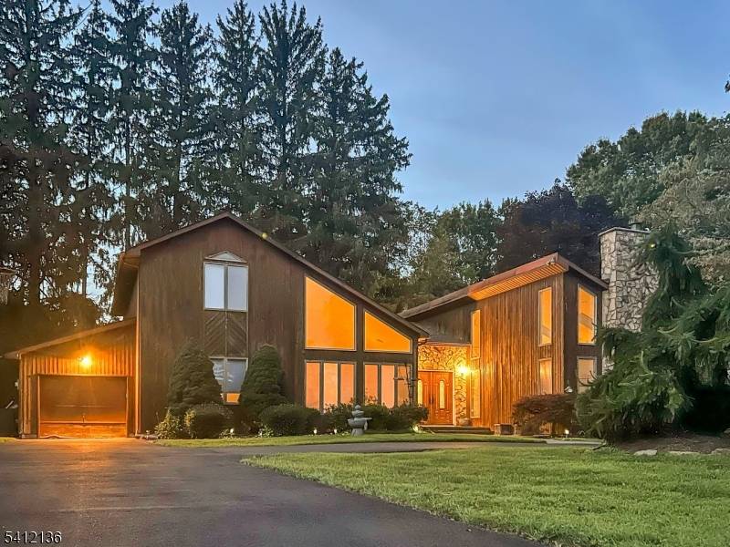 This exceptional South facing 4 bdrm, 3 bath contemporary residence is tucked away on a peaceful cul de sac, offering a perfect blend of style, and comfort.