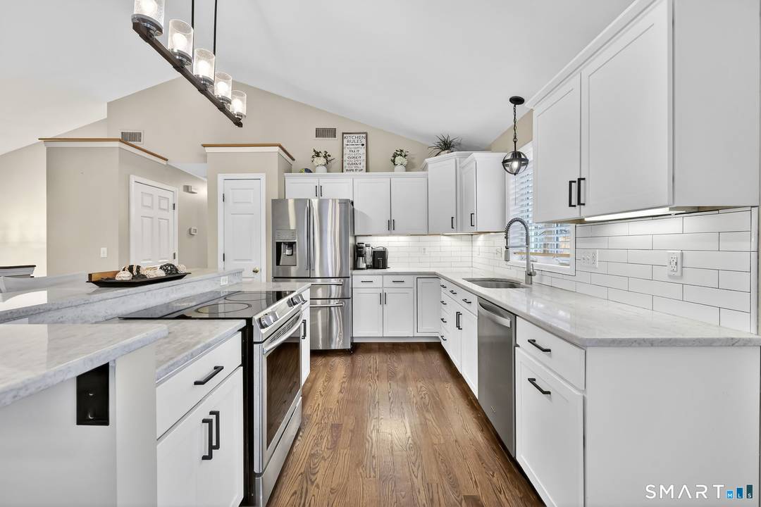 Welcome to 1021 Suffield Street, a beautifully updated contemporary raised ranch designed for modern living.