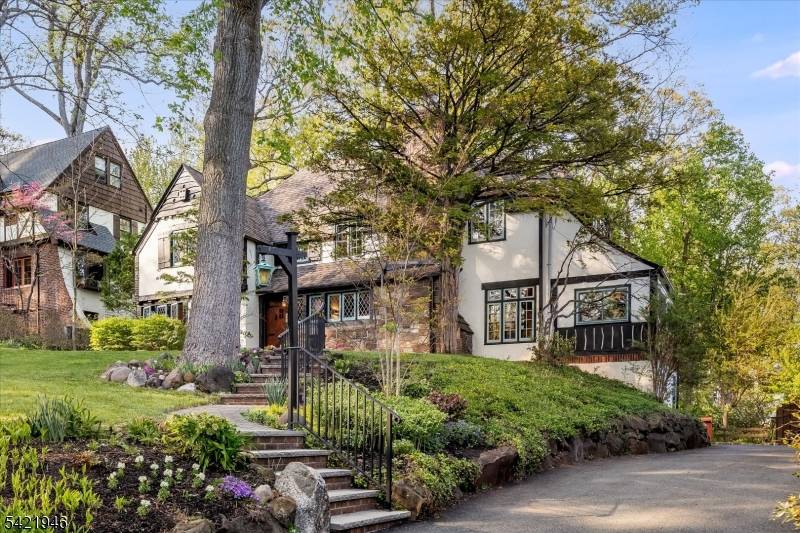 With unmatched storybook curb appeal, it's the warmth, character, and feeling of home that make this 4 bdrm, 3 bath Maplewood gem truly unforgettable !