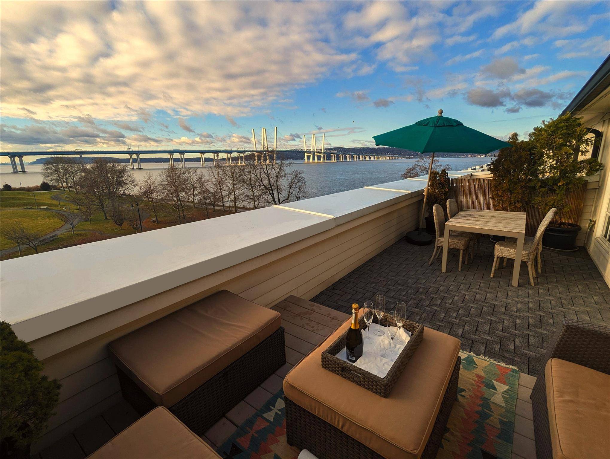 Welcome to 153 West Main Street, an exceptional waterfront residence nestled within the coveted Hudson Harbor community.