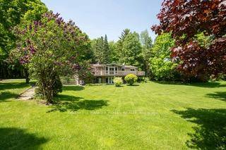 Discover this beautifully updated bi level bungalow with an estimated finished living space of 2, 436 square feet set on a serene 1.