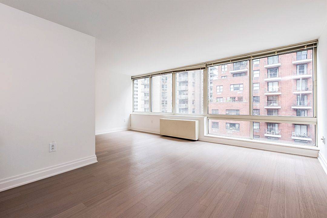 Large alcove studio with distinct sleeping alcove, living area, and bonus flex space perfect for a dedicated dining or home office area.