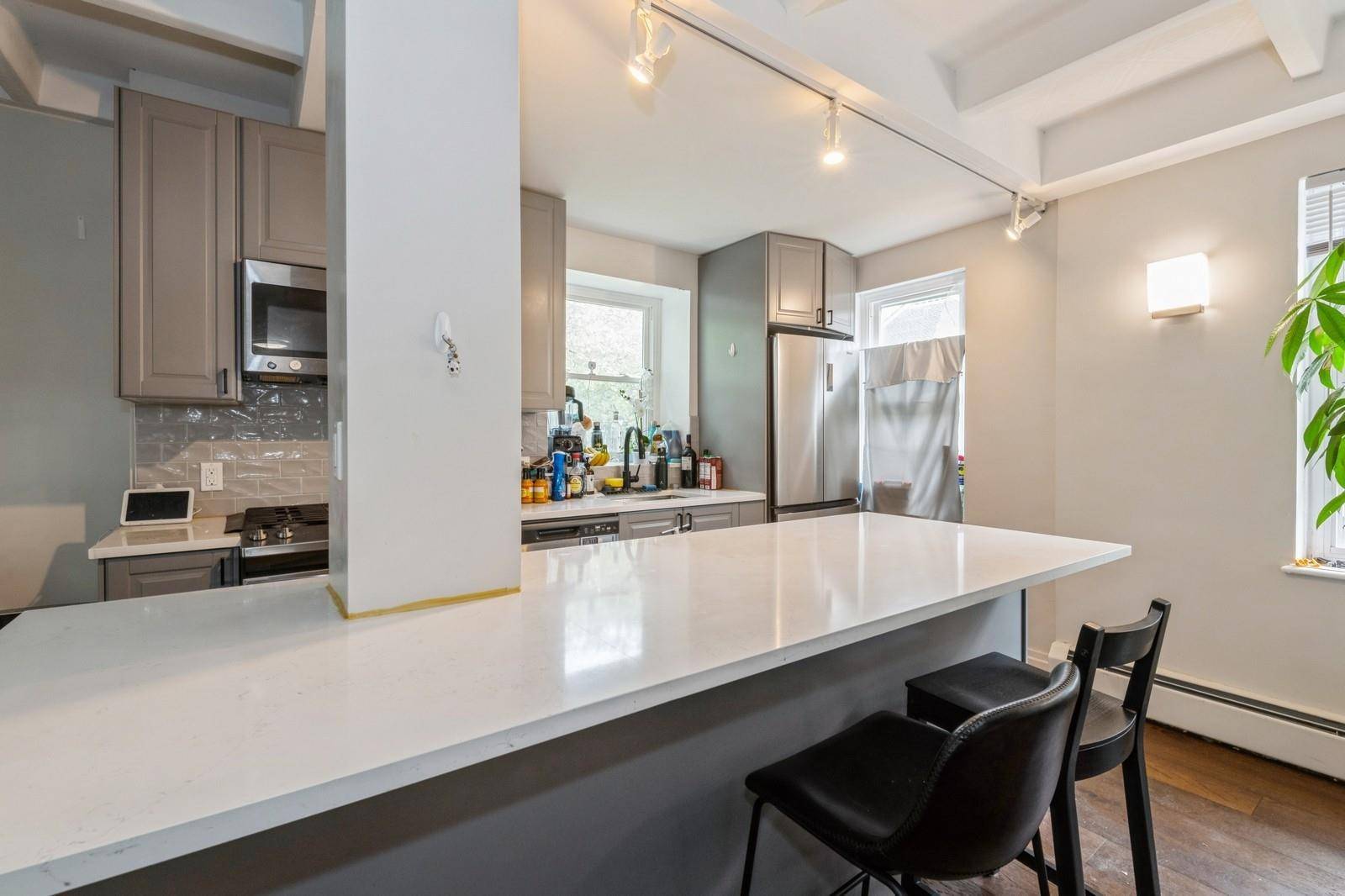 Renovated 2BR 2BA Duplex in a Tranquil Garden Co op Tucked away in a peaceful garden style co op, this sunlit, corner unit duplex offers a private, serene retreat.