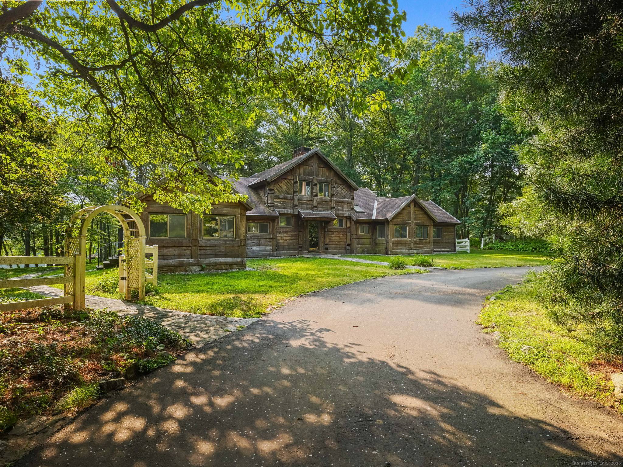 Here a dramatic, spacious one of a kind waterfront home and property on shimmering Beaver Dam Lake beautifully sited in this prestigious north Stratford neighborhood association.