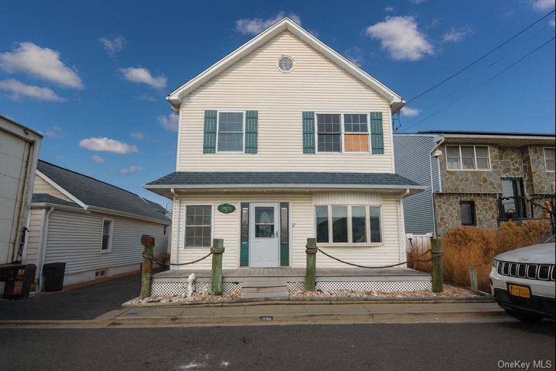 Waterfront Colonial On Desirable Beach Avenue In Bellmore Featuring Direct Water Views And A Huge Rear Deck Perfect For Entertaining.