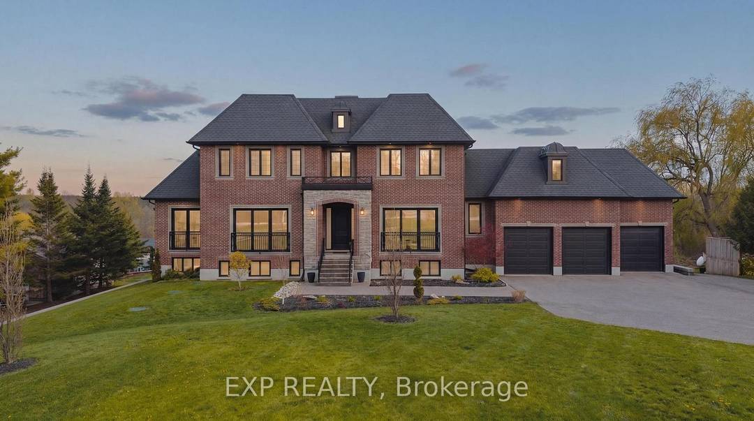 Tucked at the end of a sweeping 200' private driveway, this extraordinary estate commands nearly 2.
