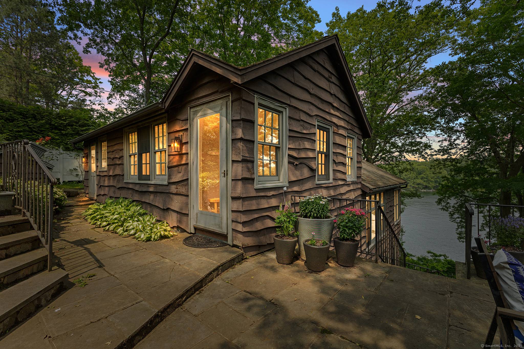 Welcome to this beautifully expanded vintage cottage on sought after Candlewood Isle.