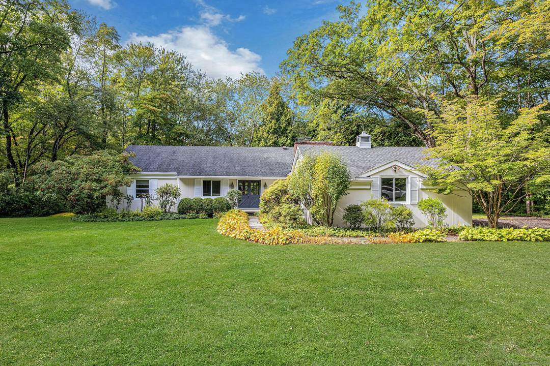 Nestled in a serene, nature filled setting, this contemporary 4 bedroom ranch offers the perfect blend of comfort and style.