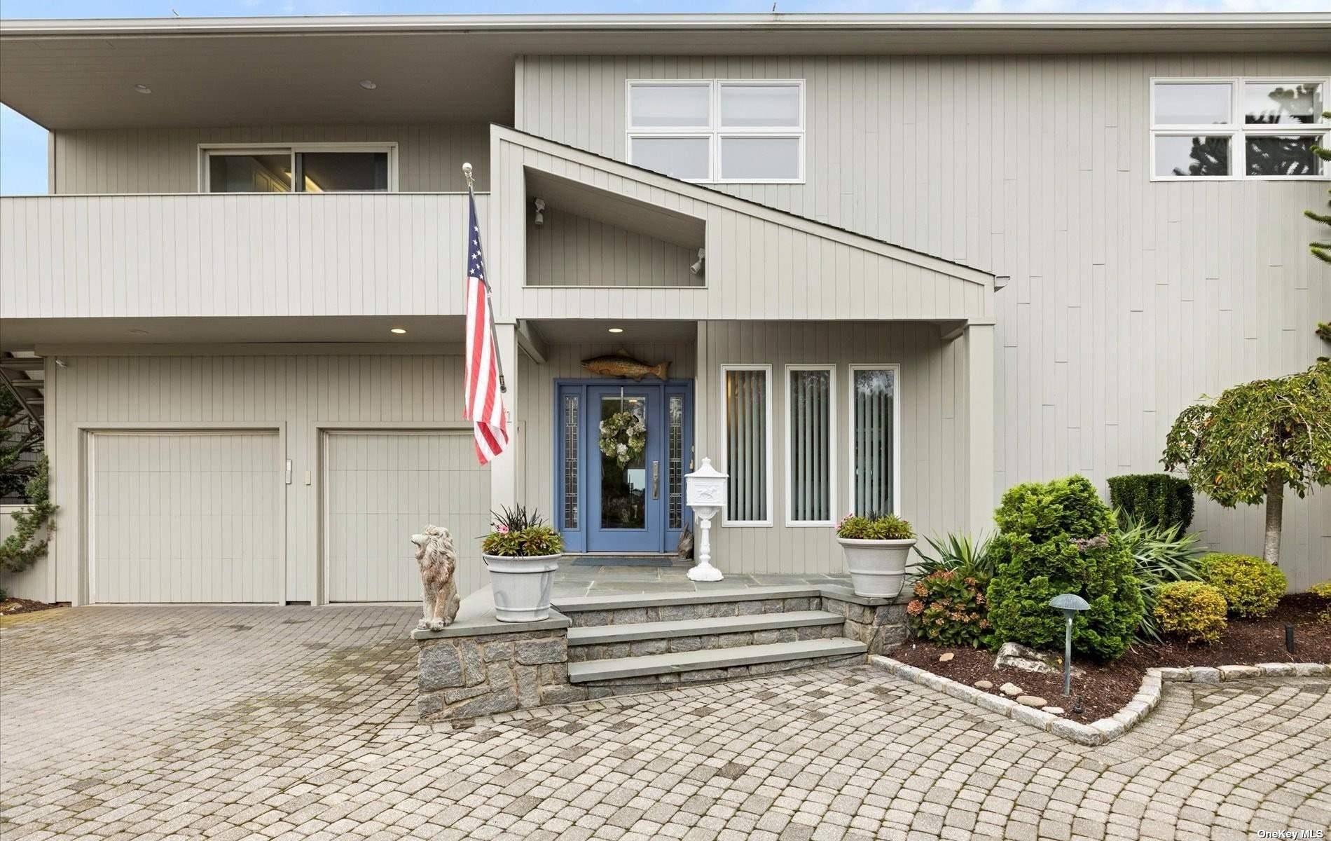 Experience waterfront luxury at its finest in this exquisite Amityville property boasting unparalleled bay views from both floors.