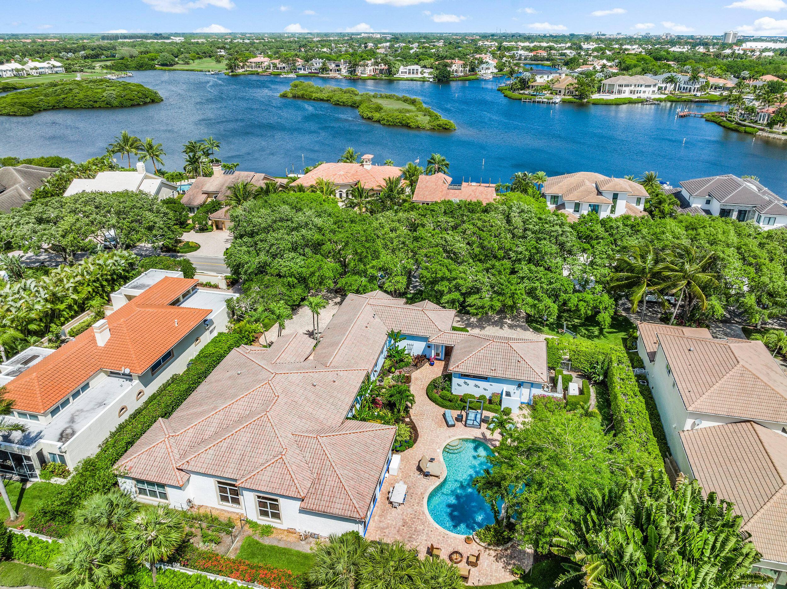 DOUBLE LOT Situated in the prestigious Admirals Cove, this property stands as a rare gem, encompassing one of the few double lots available.