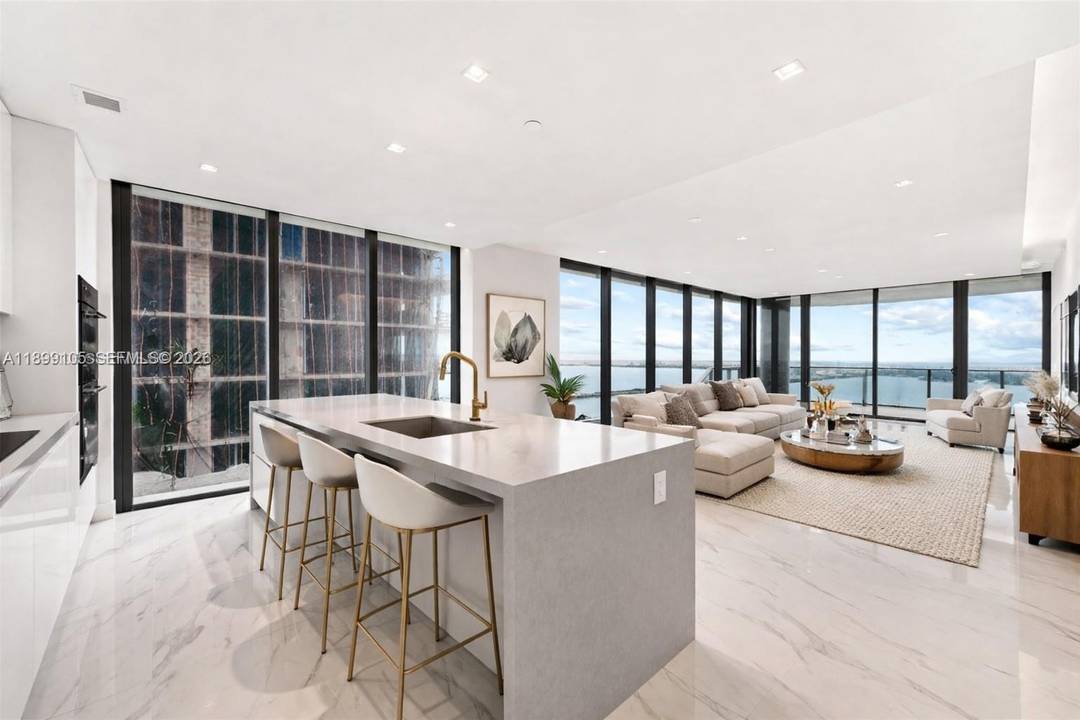 Spectacular high floor residence at Aria Reserve South Tower, Line 01 54th floor, featuring 4 bedrooms office with direct Biscayne Bay and Ocean views.