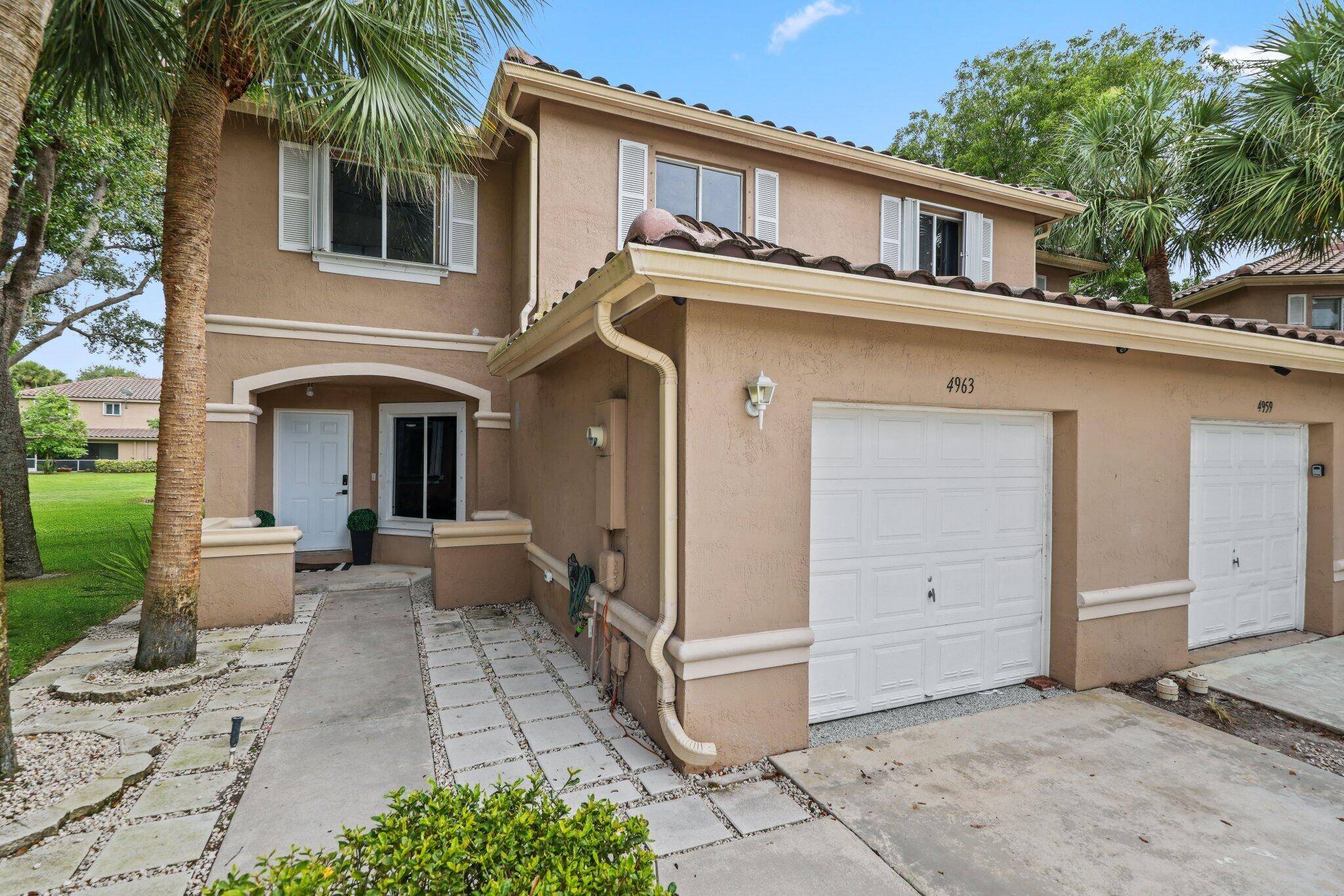 Welcome to 4963 Pinemore Lane, a renovated townhouse in a gated community with 3 beds den and 2.