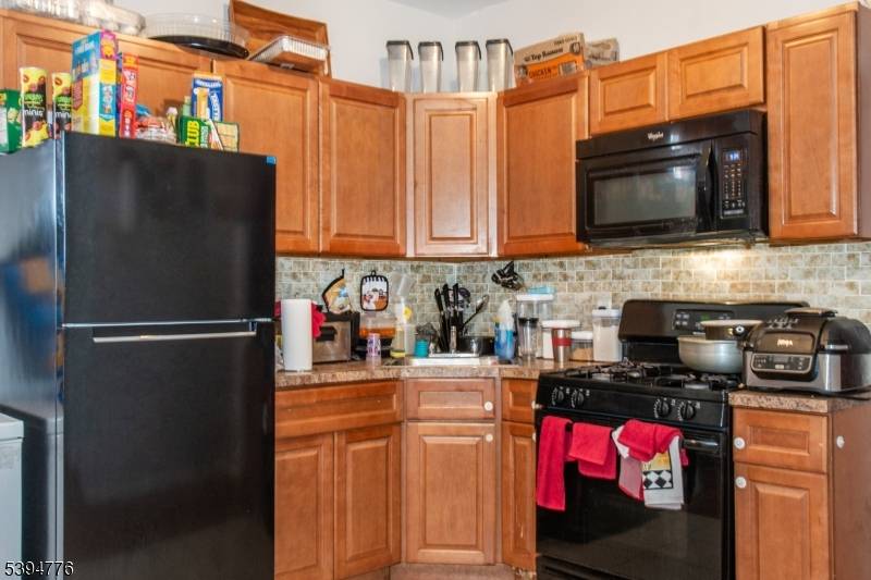 This well maintained three family home offers three bright and comfortable units, each featuring two bedrooms, a living room, kitchen, and full bathroom.