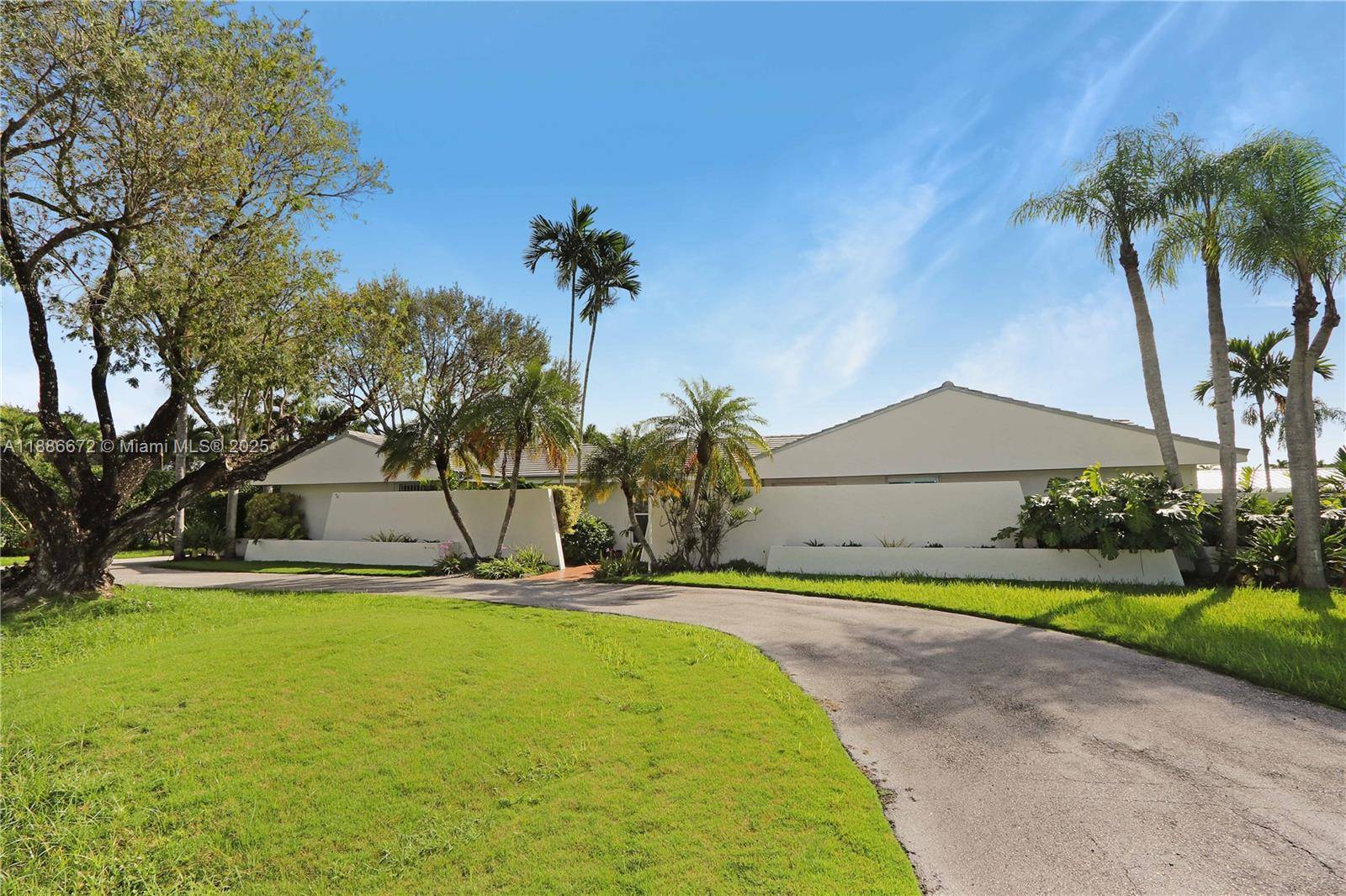Beautifully updated 4 bedroom, 3 bath home featuring a split floor plan, marble flooring, and an open concept living area.