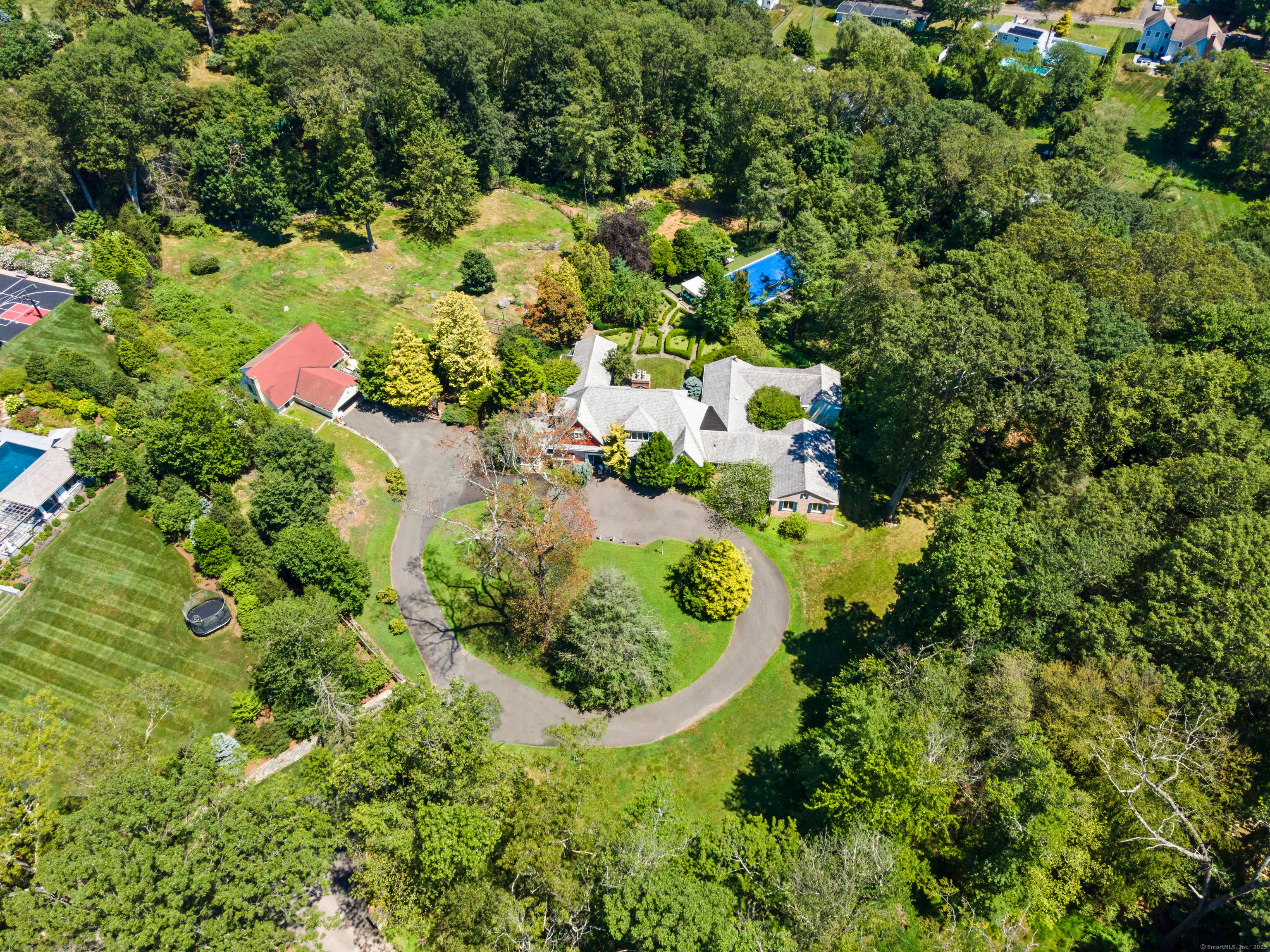 A rare investment opportunity to own a storied 1936 estate on a desirable, private street in the heart of Westport.