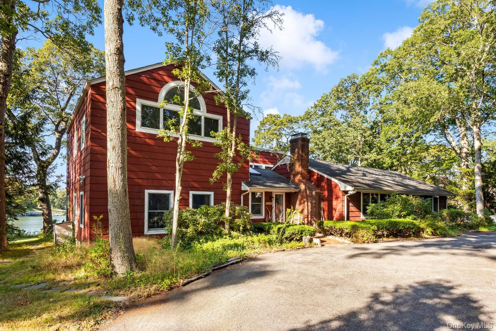 Elegant Waterfront Retreat on the North Fork Welcome guests in style at this exquisite waterfront residence, where timeless design meets relaxed coastal living.