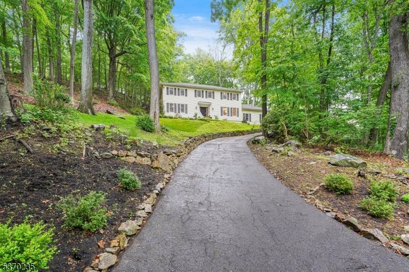 Nestled in one of Morris Township's most desirable neighborhoods, 32 Lord William Penn Dr is a private retreat on 3 beautifully landscaped acres in sought after Bradford Estates.