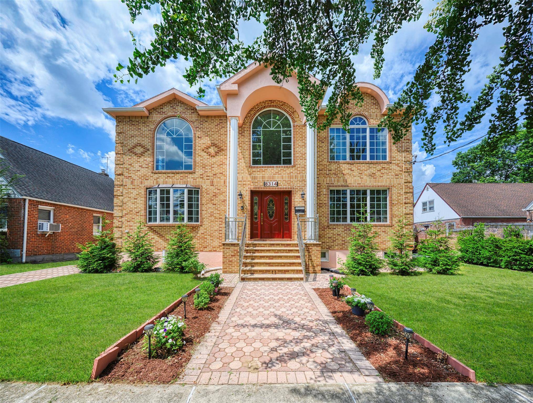 This beautifully reimagined custom brick home with soaring columns offers luxurious living with modern updates from the ground up, situated on a 60x100 lot.