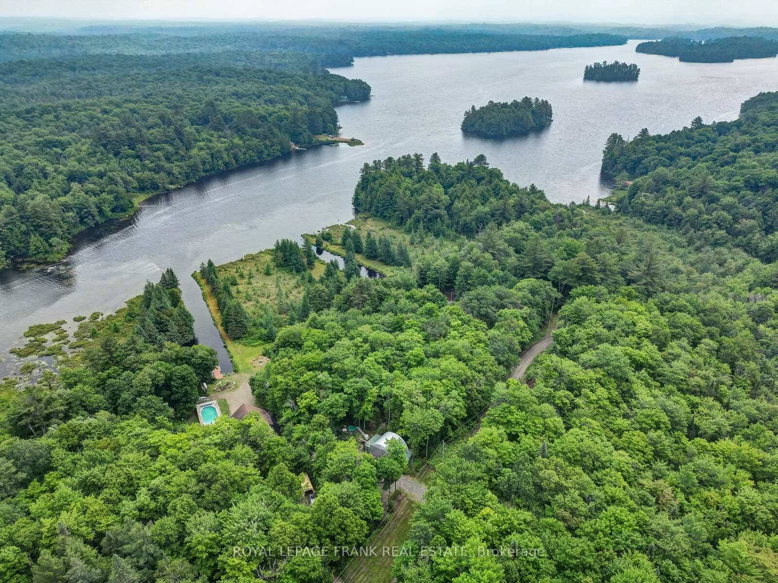 MUSKOKA Waterfront Oasis, just under 4 acres on desirable Wood Lake.