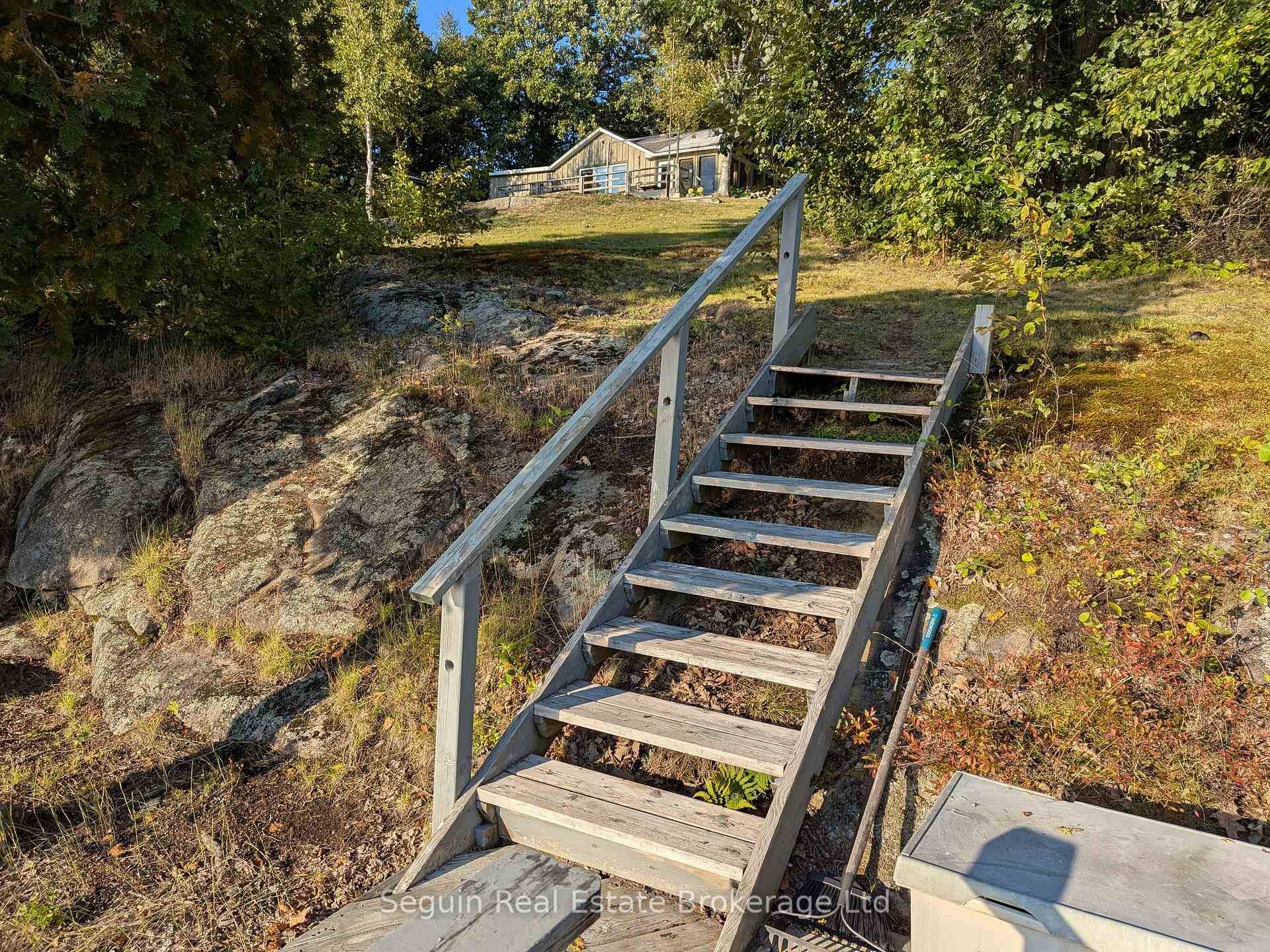 Custom country cottage on 1 acre with 300' of clean and deep smooth rock Canadian Shield shoreline.