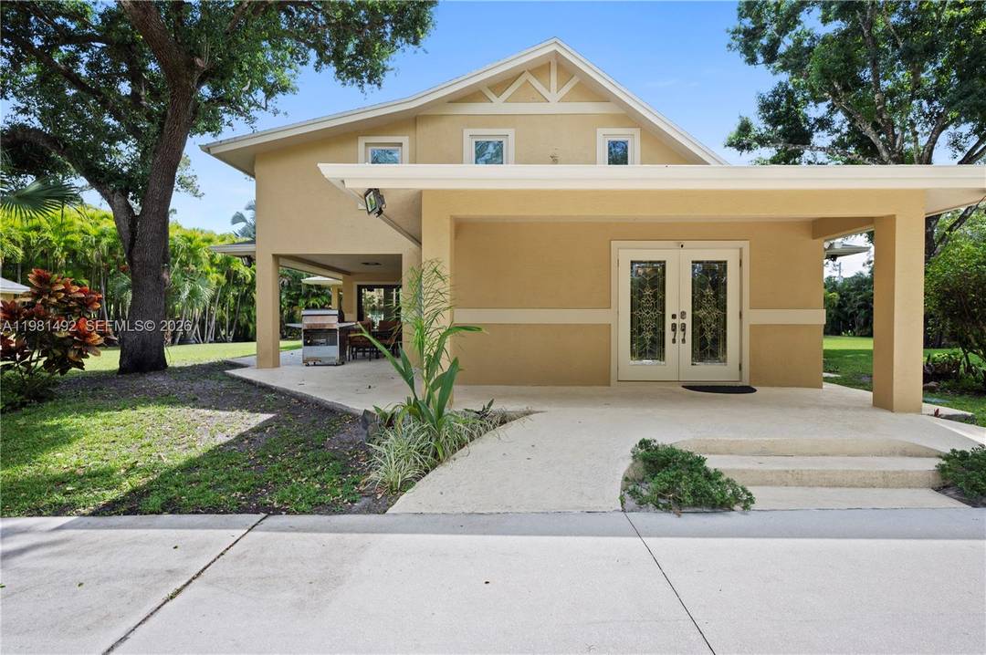 Rare custom concrete estate on paved roads in Jupiter Farms.