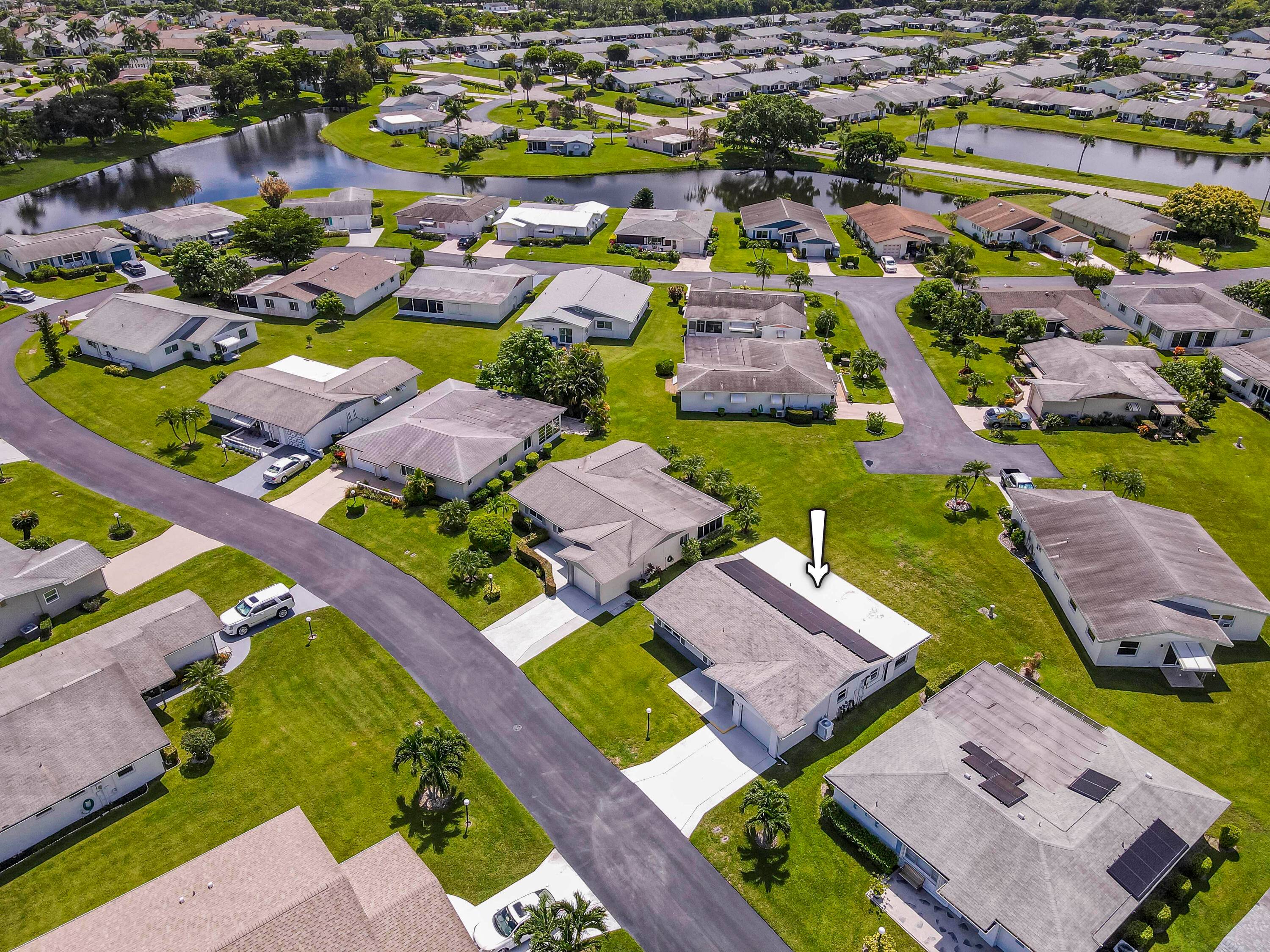 Welcome to 5398 Belleville Rd in the desirable gated 55 community of Cypress Lakes, West Palm Beach.