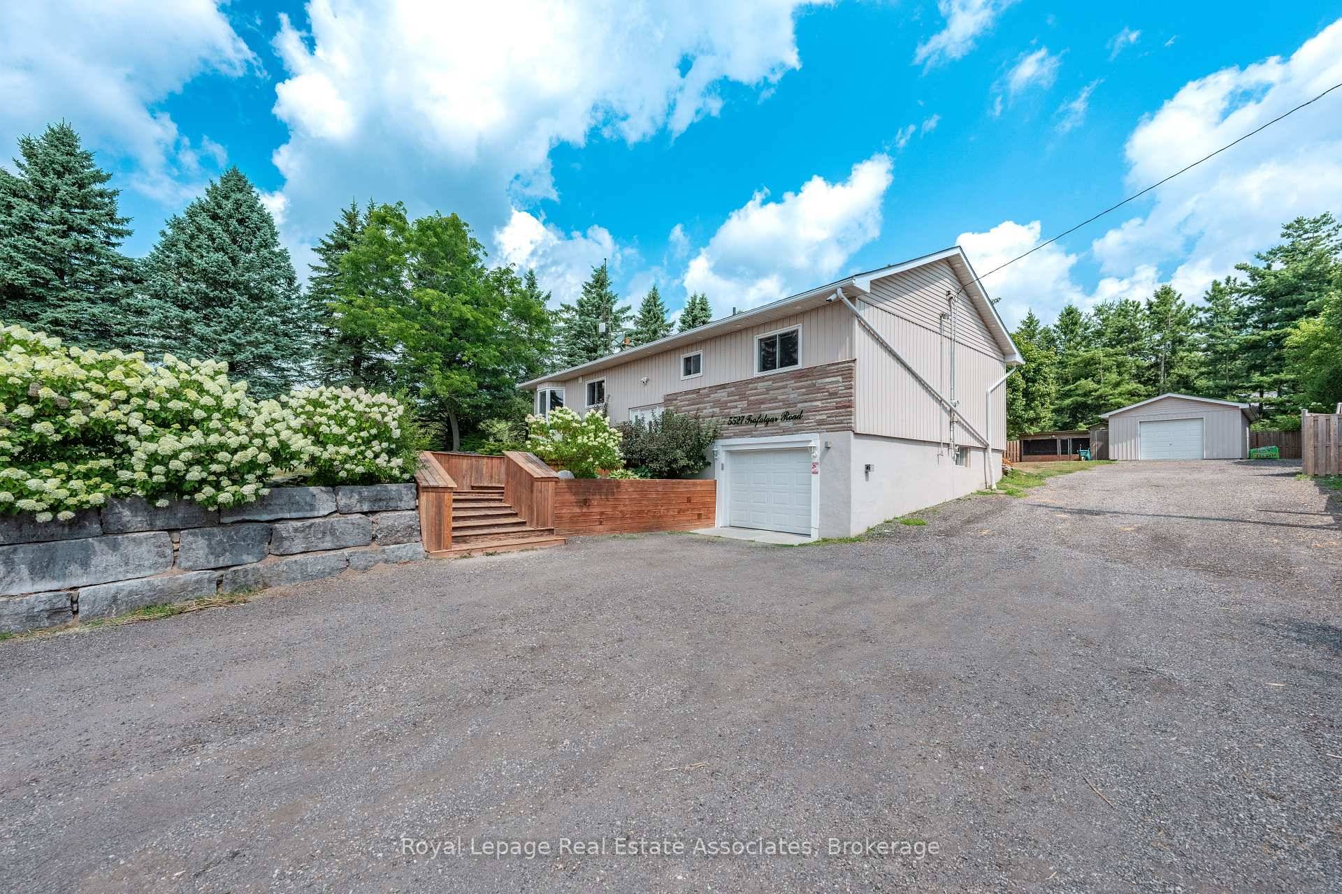 Well Set Back From The Road Nestled On 1 2 Acre Lot Sits This Raised Bungalow Offering A Total Of 2, 000 SqFt.